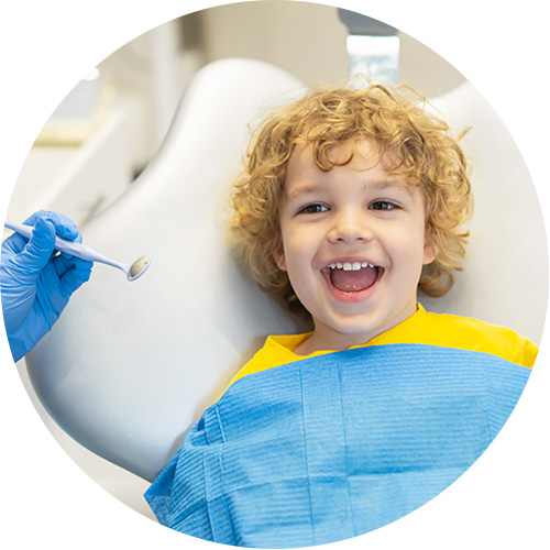 Smiling boy on dental chair