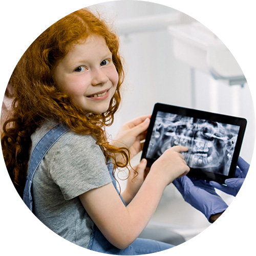 Girl looking at her x ray with doctor